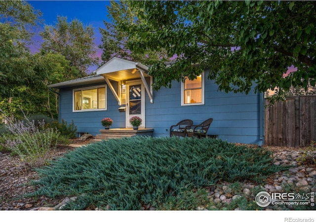 view of front of home with fence