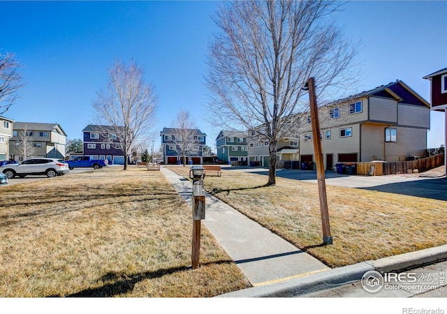 view of yard featuring a residential view