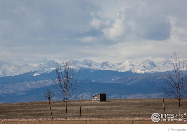 mountain view featuring a rural view