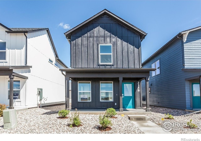 3282 Crusader St, Fort Collins, CO 80524 - view of front of home featuring board and batten siding and covered porch