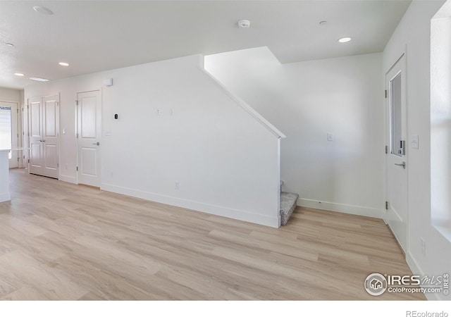 3282 Crusader St, Fort Collins, CO 80524 - entryway with stairs, light wood-style floors, recessed lighting, and baseboards