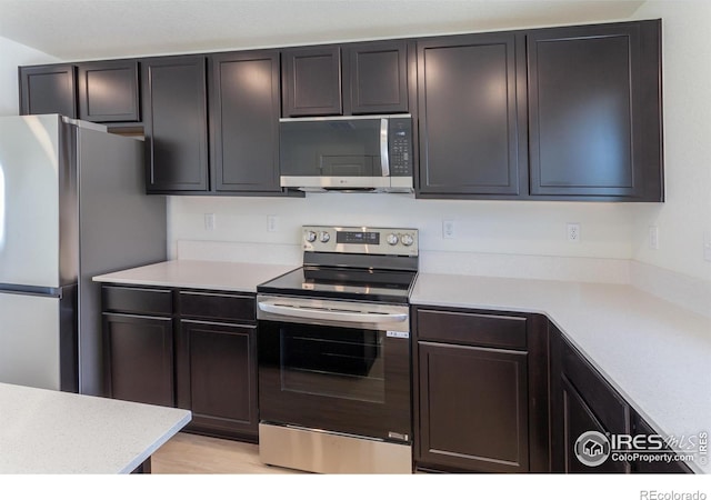 3282 Crusader St, Fort Collins, CO 80524 - kitchen featuring stainless steel appliances and light countertops