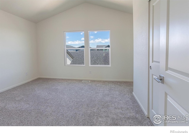 3282 Crusader St, Fort Collins, CO 80524 - carpeted empty room with lofted ceiling and baseboards
