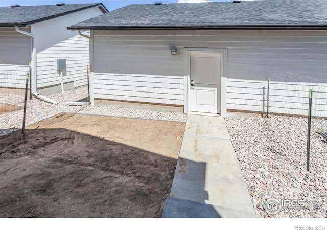 3282 Crusader St, Fort Collins, CO 80524 - doorway to property featuring roof with shingles