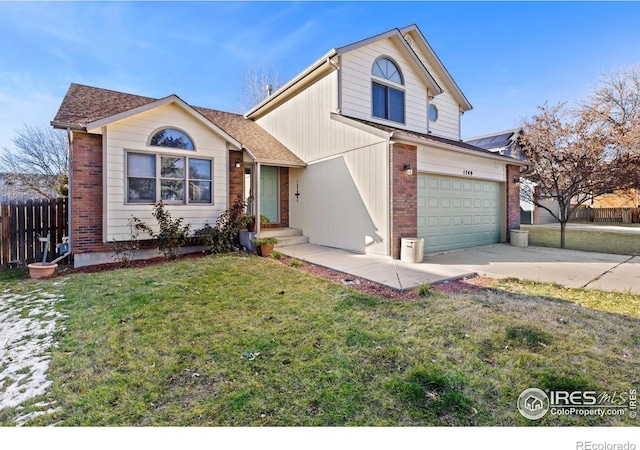 view of front of property featuring concrete driveway, brick siding, a front lawn, and fence