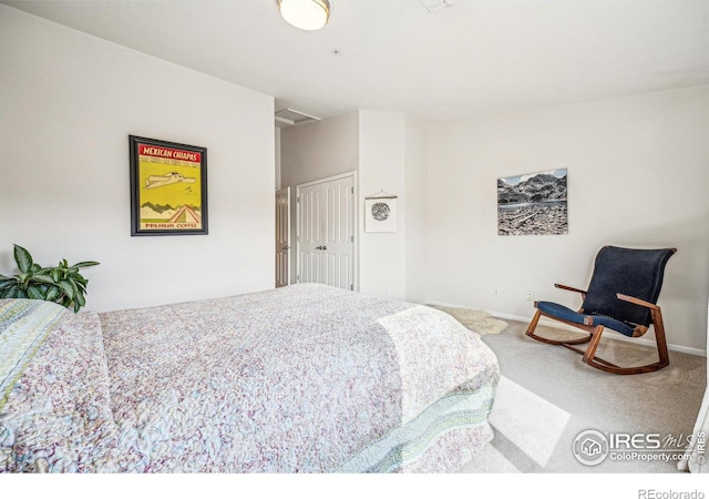 bedroom featuring carpet flooring and baseboards