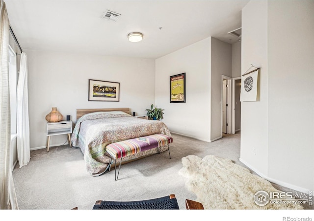 bedroom with carpet, visible vents, and baseboards