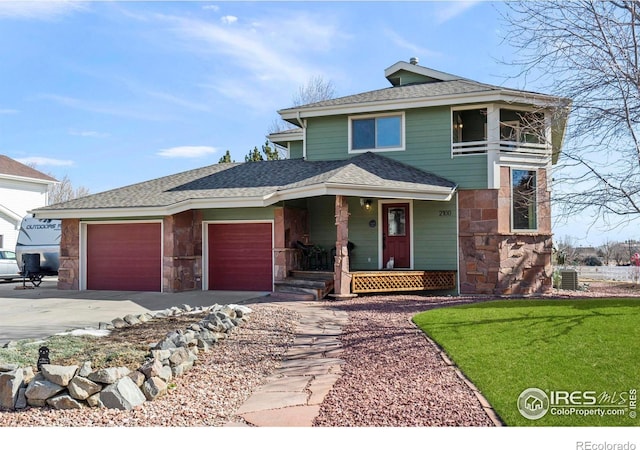 view of front facade with a garage, stone siding, central AC unit, and driveway