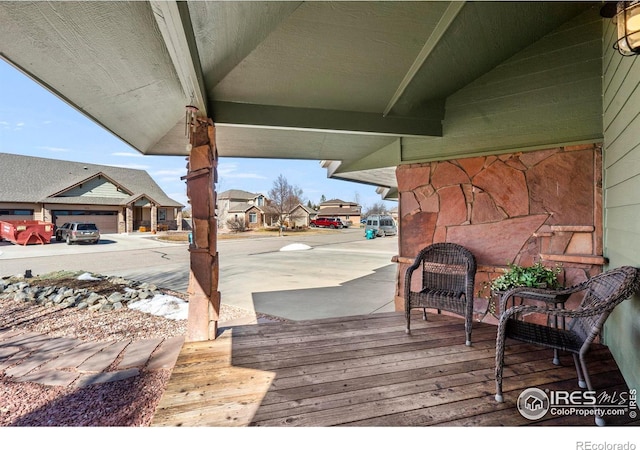 wooden deck featuring a residential view