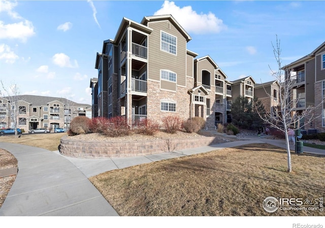 view of building exterior with a residential view