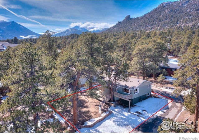 bird's eye view featuring a mountain view and a wooded view