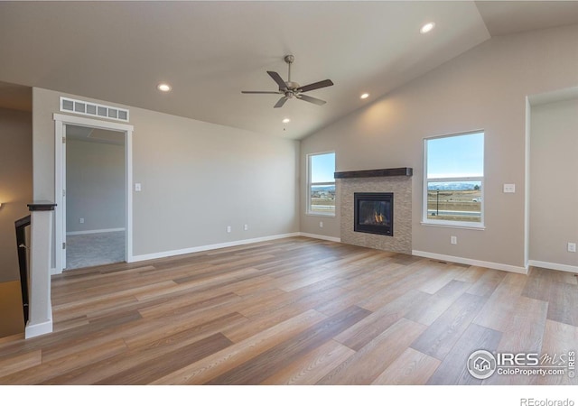 unfurnished living room with visible vents, a tile fireplace, ceiling fan, light wood-style floors, and recessed lighting