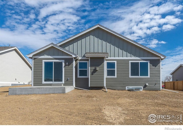 back of property with board and batten siding