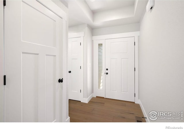 6997 Feather Reed Dr, Wellington, CO 80549 - entrance foyer with wood finished floors and baseboards