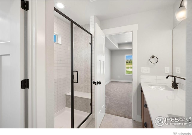6997 Feather Reed Dr, Wellington, CO 80549 - full bathroom featuring vanity, a stall shower, recessed lighting, and baseboards