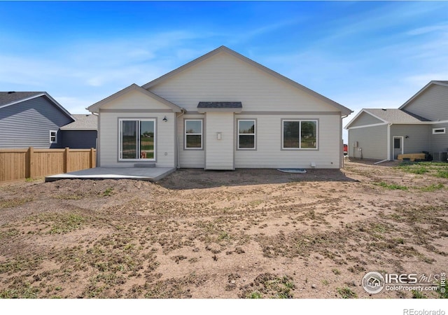 6997 Feather Reed Dr, Wellington, CO 80549 - back of house featuring a patio and cooling unit