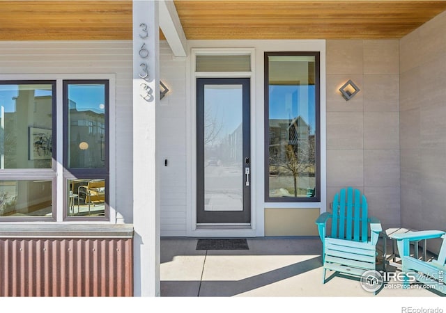 property entrance featuring covered porch