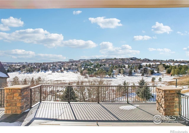 view of snow covered deck