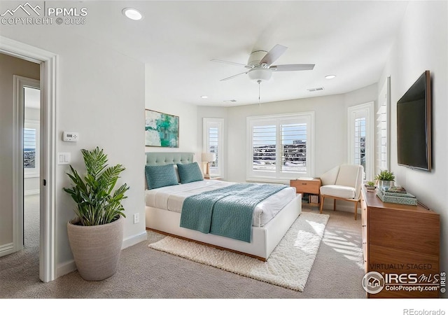 carpeted bedroom featuring baseboards, visible vents, ceiling fan, and recessed lighting