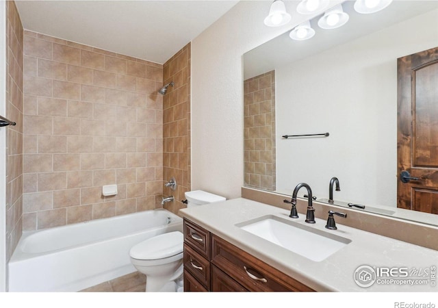 bathroom with shower / washtub combination, vanity, and toilet