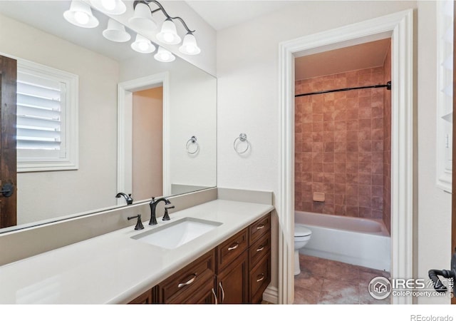 bathroom with shower / bath combination, vanity, toilet, and tile patterned floors