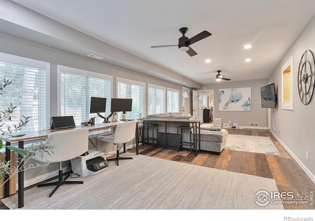 office featuring baseboards, wood finished floors, visible vents, and recessed lighting