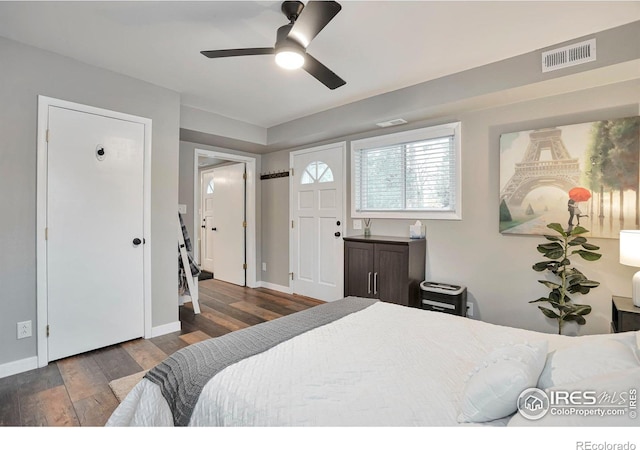 bedroom with visible vents, ceiling fan, baseboards, and wood finished floors