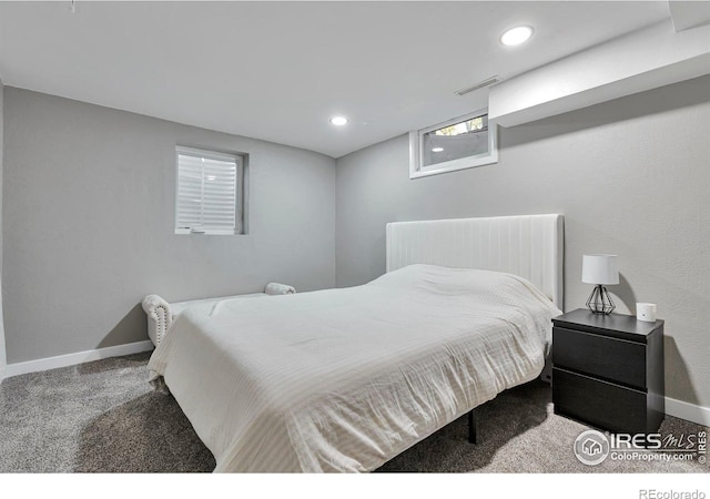 carpeted bedroom with recessed lighting, visible vents, and baseboards