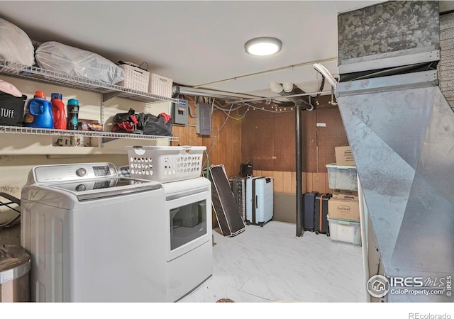 laundry area featuring marble finish floor and electric panel