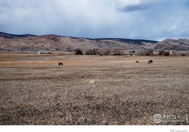 mountain view featuring a rural view