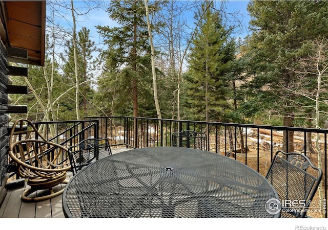 wooden deck with outdoor dining area