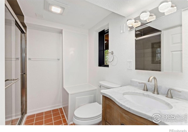bathroom with a stall shower, toilet, baseboards, tile patterned flooring, and vanity