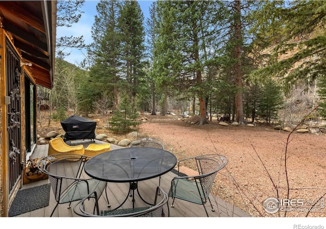 view of patio featuring area for grilling and outdoor dining area