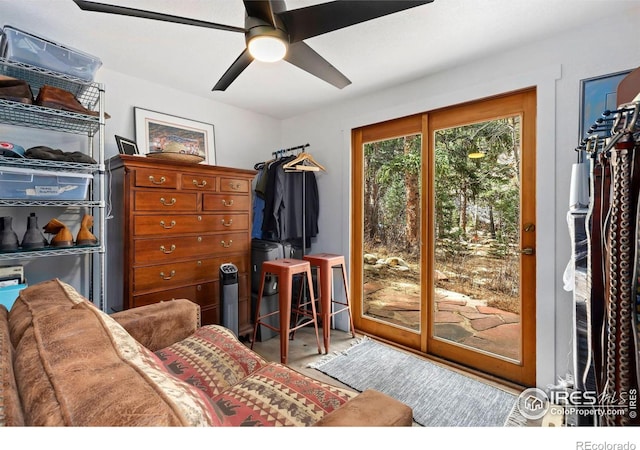 interior space with ceiling fan