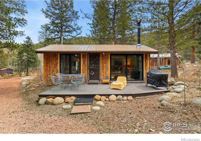 818 Riverside Dr, Lyons, CO 80540 - rear view of house with metal roof