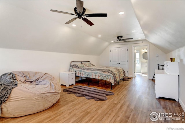 bedroom featuring ceiling fan, recessed lighting, wood finished floors, baseboards, and vaulted ceiling