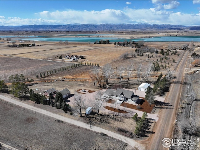 birds eye view of property featuring a mountain view