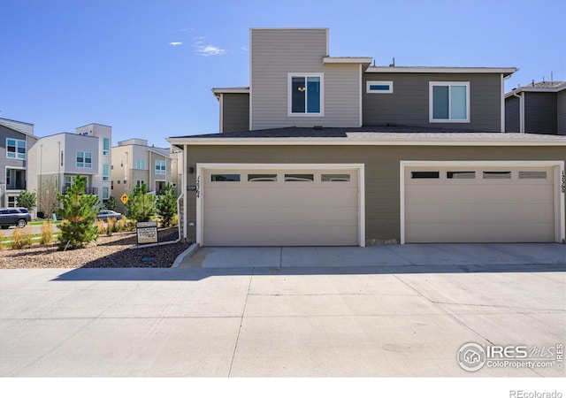 view of front of property with an attached garage and concrete driveway