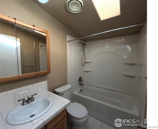 bathroom featuring shower / washtub combination, vanity, and toilet