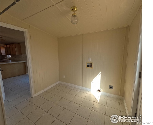 laundry area with light tile patterned floors, hookup for a washing machine, hookup for an electric dryer, laundry area, and wood ceiling