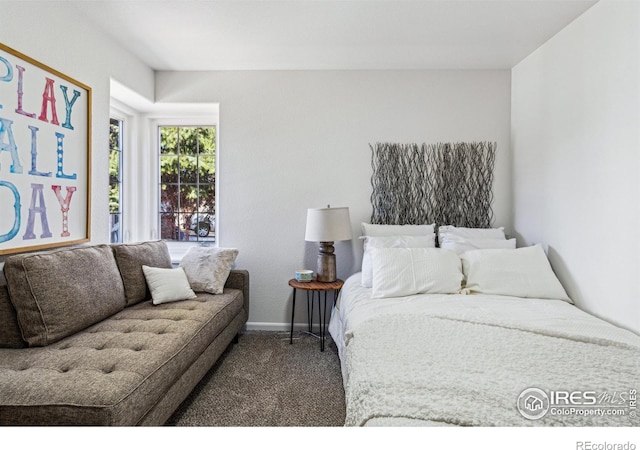 bedroom with carpet flooring and baseboards