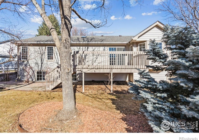 back of house with stairs and a deck