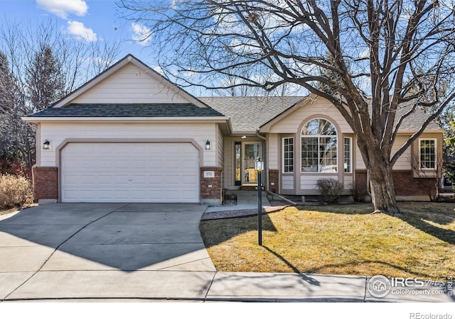 ranch-style house featuring a garage, driveway, brick siding, and a front lawn