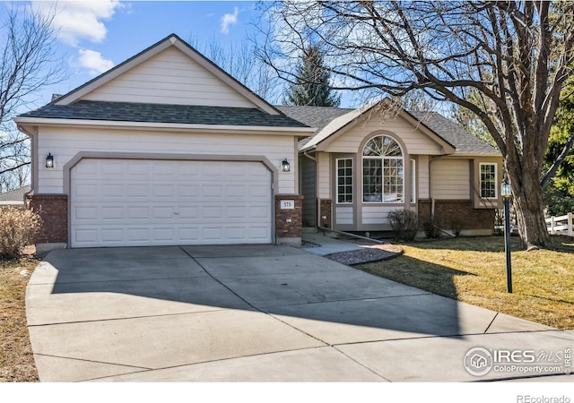 ranch-style house with driveway, a garage, roof with shingles, a front lawn, and brick siding