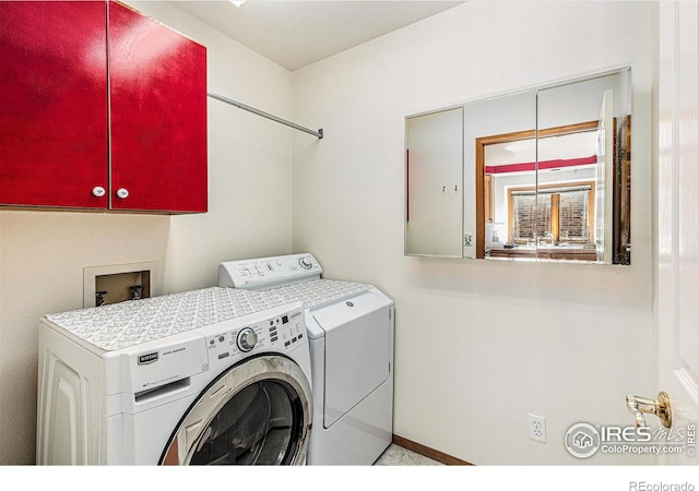 clothes washing area featuring independent washer and dryer and cabinet space