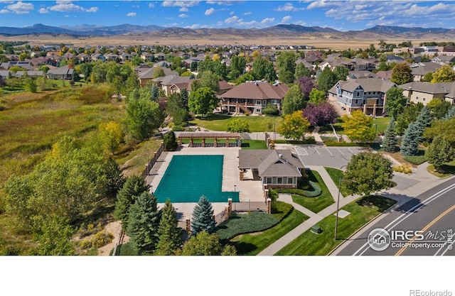 drone / aerial view featuring a residential view and a mountain view