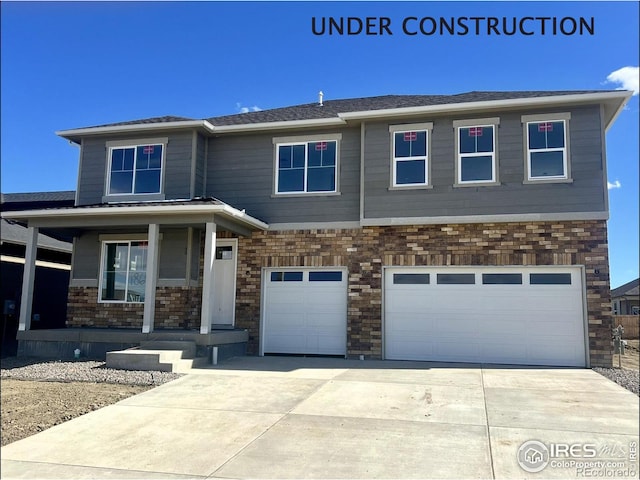 view of front of property featuring concrete driveway, a porch, an attached garage, and stone siding