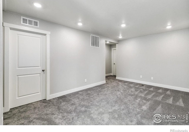 basement with carpet floors, visible vents, and recessed lighting