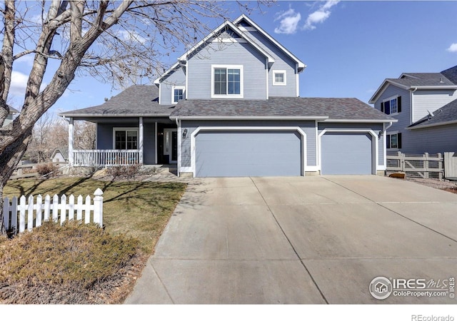 view of front of home featuring covered porch, driveway, an attached garage, and fence