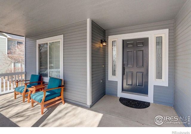 doorway to property featuring covered porch